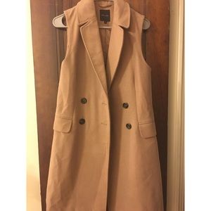 Long beige winter vest